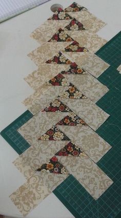 the quilts are laid out on the table to be sewn together with scissors