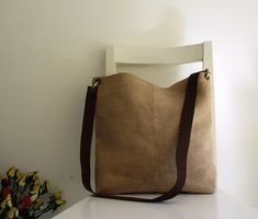 "An everyday bag, simple basic PERFECT lightweight bag. You can wear it as a shoulder short strap bag or with a long strap as a messenger. Great for carrying anything for the day. The exterior is rough upholstery canvas. The bag is lined and has two inside pockets, one is designed for a cell phone. The adjustable strap is genuine leather. The bag closes with a magnetic snap. Measurements: Shoulder strap: 18\" ( 45 cm) Messenger: 36\" ( 90 cm) Height: 14\" ( 35 cm) Width at the top: 15\" ( 37.5 c Versatile Shoulder Bag With Long Strap For Everyday, Versatile Everyday Bags With Long Strap, Square Shoulder Bag With Adjustable Handle For Everyday Use, Square Bag With Long Strap For Everyday Use, Square Bags With Long Strap For Everyday Use, Square Everyday Bags With Long Strap, Brown Bag With Long Strap For Daily Use, Everyday Beige Bag With Long Strap, Everyday Bucket Bag Tote With Long Strap