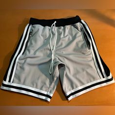 High Quality Basketball Shorts With A Minimal Approach To Ath-Leisure. Gray Athleisure Bottoms For Summer, Sporty Gray Athletic Shorts For Spring, Gray Sporty Summer Pants, Sporty Gray Summer Pants, Sporty Gray Pants For Summer, Gray Athleisure Summer Pants, Gray Athleisure Shorts For Spring, Athleisure Gray Shorts For Spring, Gray Bottoms For Summer Streetwear