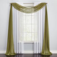 an open window with sheer curtains in front of it and wood flooring below the windowsill