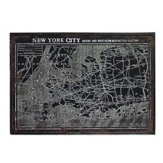 an old metal sign with the map of new york city on it's side