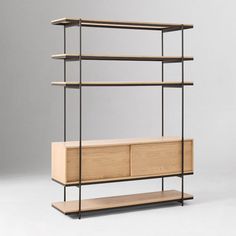 a wooden shelf with two metal shelves on each side and an open drawer in the middle