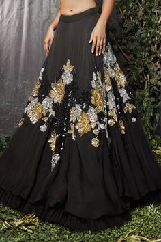 Black organza lehenga with gold and silver cutdana and tikki hand embroidery. Comes with a blouse and a dupatta.
Components: 3
Pattern: Hand embroidered
Type Of Work: Cutdana, Tikki
Neckline: Sweetheart
Sleeve Type: Sleeveless
Fabric: Organza, Dupatta : Net
Color: Black
Other Details: 
Closure :
Lehenga : Side zip
Blouse : Back hooks
Note : Outfit worn by the model on the right is not for sale.
Occasion: Sangeet - Aza Fashions Black Organza Lehenga, Sunaina Khera, Side Zip Blouse, Lehenga Black, Organza Lehenga, Anarkali Dress Pattern, Embroidered Lehenga, Couture Embroidery, Designer Party Wear Dresses