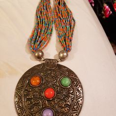 Never Worn. Purchased From A Market In India. 17 Inches From Top To Bottom. Pendant Is 4.25 Inches In Diameter. This Is A Magnificent Statement Piece. Colorful Seed Beads. Bohemian Beaded Necklace With Polished Round Beads, Bohemian Round Beaded Necklace With Polished Beads, Bohemian Polished Round Beaded Necklace, Bohemian Round Beaded Chain, Bohemian Beaded Necklaces With Silver Beads, Bohemian Colorful Round Beads, Traditional Multicolor Beaded Necklace With Silver Beads, Bohemian Metal Beaded Necklaces For Festivals, Traditional Beaded Necklace With Colorful Metal Beads