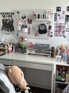 a desk with a stuffed animal sitting on top of it