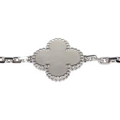 This Van Cleef & Arpels Vintage Alhambra 5 Motif Bracelet is in white mother of pearl and 18K white gold. There are five clover motifs of mother of pearl set in 18K white gold with a hallmark lobster clasp closure.Origin: FranceCondition: New and never wornAccompanied by: VCA gift box, VCA green jewelry box, authenticity card, carebookMeasurements: .5" x .5" motif pendant; 7" bracelet length Luxury Jeweled White Sterling Silver Bracelet, Luxury White Gold Chain Bracelet Tarnish Resistant, Luxury White Gold Tarnish-resistant Chain Bracelet, Luxury White Gold Chain Bracelet With Polished Finish, Luxury Engraved Diamond Bracelet, Luxury White Sterling Silver Jubilee Bracelet, Luxury Engraved White Gold Chain Bracelet, Luxury White Sterling Silver Chain Bracelet, Luxury White Sterling Silver Bracelet