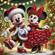 mickey and minnie dancing in front of a christmas tree