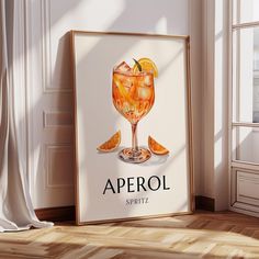 a poster with an image of a glass of aperol spritz on it