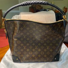 Only A Limited Amount Of These Were Made When They Were Produced In 2017. If You Want A Bag You Won’t See On Everyone, Then This Is For You. This Stunning Louis Vuitton Black Monogram Lambskin Leather Triangle Softy Bag Is An Everyday Bag For Any Women. Crafted Out Of Luxurious Monogram Canvas And Reverse Monogram Canvas, This Shoulder Bag Is Soft And Inviting While The Elegant Braided Handle In Is The Perfect Touch Of Sophistication. The Interior Is Spacious Enough For All Your Daily Essentials. Retail Price Was $2540. Disclosure: There Are Light Marks. And Wear On Corners. Look At All Pics As They Are Disclosed. This Is A Rare Limited Edition Classic Pre-Owned Bag. Bag Will Be Authe Louis Vuitton Black, Daily Essentials, Everyday Bag, Bag Bag, Lambskin Leather, A Bag, Monogram Canvas, Louis Vuitton Bag, Limited Edition