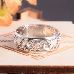 "Unique 925 sterling silver womens filigree wedding band, Simple & elegant art nouveau wedding band for her, Dainty art deco wedding band This is a stunning, feminine ring that works well for all occasions, styles, and ages. You will love it! Ring information Metal type: Silver Metal stamp: 925 Sterling SIlver Customization / Replacements It's easy to create jewelry that's perfect for you. Change the materials to suit your style and budget: Ruby, Emerald, Blue Sapphire, Amethyst, Topaz, Garn Elegant Decorative Band Promise Ring, Elegant Jewelry Decorative Promise Ring, Elegant Carved Jewelry For Promise Ring, Elegant Anniversary Jewelry With Decorative Band, Carved Adjustable Jewelry For Wedding, Sterling Silver Engraved Ring With Carved Details For Wedding, Carved Ring Jewelry For Anniversary, Elegant Carved White Gold Rings, Elegant Bands With Intricate Design For Gift