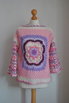 This is a timeless hand crochet Boho style sweater, jumper. It's ideal for transitional months or for cold summer evenings. Featuring a mandala in the centre of a jumper can be worn bought sides.  Pair with your favourite jeans for a cool Boho, casual look. Size: M Material: Acrylic Measurements: Bust: 104cm/40in Waist: 104cm/40in Sleeves: 39cm/15in Length: 56cm/22in Handmade Bohemian Cotton Sweater, Bohemian Crochet Lace Crew Neck Sweater, Handmade Cotton Bohemian Sweater, Bohemian Crochet Lace Top With Crew Neck, Winter Bohemian Crochet Top With Crew Neck, Winter Bohemian Cotton Crochet Top, Bohemian Crochet Crew Neck Top, Bohemian Crochet Top With Crew Neck, Multicolor Bohemian Crew Neck Crochet Top