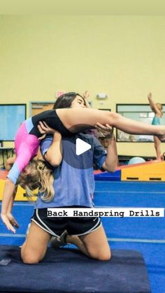 two girls are doing exercises on a mat