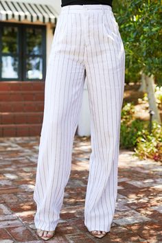 You won't find a better spring-summer pant anywhere else! The Carina Blue Striped Pants are the pants of the season. Featuring a pinstripe fabric, two side pockets, two back welt pockets, a partially elastic waistband for an adjustable fit, a button zipper closure, belt loops, and a straight fit. Style with the Enid Tank Top to complete the look! Blue Striped Pants, Pinstripe Fabric, Latest Colour, Summer Pants, White Pants, Fit Style, Striped Pants, Welt Pockets, Welt Pocket