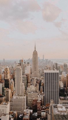 an aerial view of the city with tall buildings