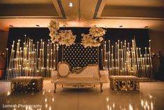 an elegant stage set up with flowers and candles