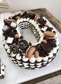 a cake decorated with chocolate, marshmallows and cookies