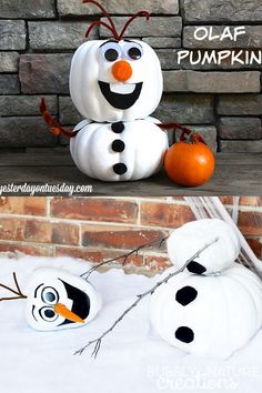 two pumpkins made to look like snowmen with faces painted on them