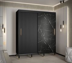 a black and white cabinet in a room with marbled walls, flooring and lighting