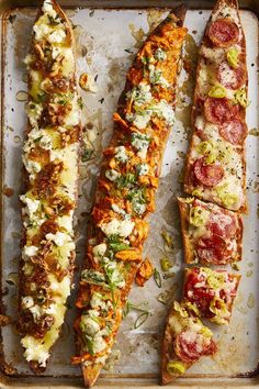 three different types of bread on a baking sheet, one with toppings and the other topped with cheese