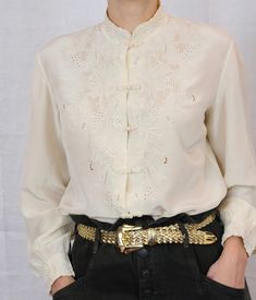 "Stunning one of a kind piece, pure silk ivory blouse. Hand embroidery. Pure silk. Chinese collar. Frog closure. Fits XS-M best (the model has S size frame)  Excellent condition. Measurements: Shoulders  back: 16\" Chest: 20\" All garments are hand washed (or dry cleaned) in eco-friendly detergent.  Please note: Vintage garments are one-of-a kind and may show minimal signs of pre-loved wear, anything major will be noted. Color of product may slightly vary due to lighting. Please enjoy this piece Blouse Hand Embroidery, Frog Closure, Ear Parts, Ivory Blouse, Chinese Collar, Girly Stuff, Peasant Tops, Vintage Silk, Silk Blouse