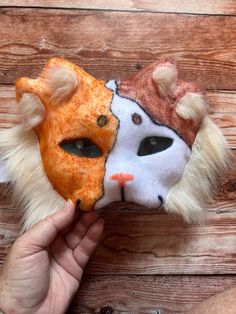 One of a kind, hand felted and colored therian mask. This purr-fect calico cat mask features fun fur, detailed eyes, and fun double set of ears. Kid sized mask is held on with elastic, contains a paper mache base coated in felt. Mask shown is the one you will receive. Cat Design Eye Mask For Masquerade, Cat Design Eye Mask For Costume Party, Masquerade Eye Mask With Cat Design, Halloween Cat Design Eye Mask, Masquerade Mask With Whiskers, Halloween Cat Design Masks With Cat Ears, Cosplay Cat Design Mask, Cosplay Cat Design Eye Mask, Cat Design Costume Eye Mask