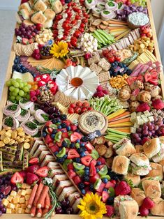 a table topped with lots of different types of foods and desserts on top of it