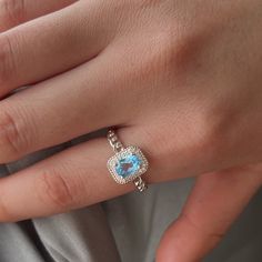 "❤ Genuine Blue Topaz Ring Basic Information ❀ Dainty blue topaz. ❀ Center Stone Size: 5x7mm. ❀ Metal Band Color ❀ Gold -- 18K gold plated sterling silver. ❀ Silver -- 18K white gold plated sterling silver. ❀ Rose Gold -- 18K rose gold plated sterling silver. ❤ 9K/14K/18K Solid Gold ❤ Please click the following links for 9K/14K/18K gold ring. www.etsy.com/listing/1412575630 ❤ Customized Top Ring ❀ Ring size is customized, US #2 till to US #16. ❀ Customize Engraved: Accept name or some simple ico Oval Topaz Ring With Gemstone Accents For Gift, Topaz Crystal Ring With Halo Setting Gift, Light Blue Oval Topaz Ring, Oval Light Blue Topaz Ring, Fine Jewelry Light Blue Oval Topaz Ring, Gift Crystal Topaz Ring With Halo Setting, Gift Topaz Crystal Ring With Halo Setting, Oval Cubic Zirconia Topaz Birthstone Ring, Oval Cubic Zirconia Topaz Ring Birthstone