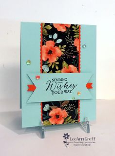 a card with flowers on it and the words sending wishes is your way written in red