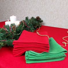 red and green napkins on a table with christmas decorations