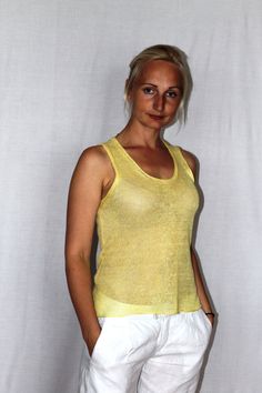 Knitted linen top from 100% linen light yellow in color. Size M All the items are knitted on hand knitting machines after patterns and the scissors are not used. After that they are washed and finishing is done by ironing. Taking care of the products containing 100% linen: Handwash or machine wash with 30 degrees and with gentle washing program. The poncho has to be dried naturally, laid out flat or on the hanger. It can be ironed with high temperature (desirably on the inside of the garment). I Fine Knit Summer Tank Top, Summer Vacation Ramie Tops, Summer Fine Knit Stretch Tank Top, Fine Knit Stretch Tank Top For Summer, Summer Stretch Fine Knit Tank Top, Summer Fitted Fine Knit Tops, Fitted Fine Knit Summer Tops, Yellow Linen Summer Tops, Stretch Linen Sleeveless Top