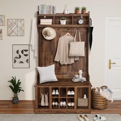 a wooden bench with shoes and bags on it in front of a wall mounted coat rack