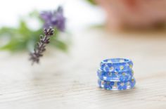 Forget me not flowers, set in crystal clear resin - truly magical! They are about 5mm wide, so they look wonderful on their own, or as chunky stacking rings. Wear this ring and literally have summer in the palm of your hand... the second to last photo shows a tiny selection of the matching forget me nots jewellery we make. To find your ring size, measure the circumference of your finger, and use the chart (last photo) to find your size. Alternatively, measure the inside circumference of a ring y Blue Flower Resin Jewelry, Handmade Blue Flower Ring, Blue Resin Rings Perfect As Gifts, Blue Resin Rings For Gifts, Blue Resin Rings Perfect For Gifts, Adjustable Blue Flower Ring For Gifting, Adjustable Blue Flower Ring Gift, Real Flower Ring, Blue Ring