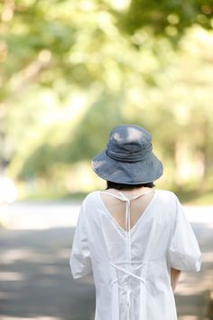 Introducing our Chic Wide Brim Sun Hat, crafted from a premium blend of cotton and linen. This stylish hat offers excellent sun protection while maintaining a sophisticated look, perfect for any outdoor activity. Material: High-quality cotton and linen blend for breathability and durability. Design: Waist pleats add texture and style, enhancing the overall feel of the hat. Adjustable Fit: Equipped with a drawstring inside the hat band, ensuring a perfect fit without worrying about hat size. Brim Wide Brim Bucket Hat, Elegant Hat, Leather Beret, Knit Beret, Bucket Hat Women, Personalized Hats, Hat Beret, Wide Brim Sun Hat, Linen Summer