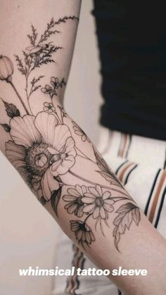 a woman's arm with flowers on it and the words whimsical tattoo sleeves