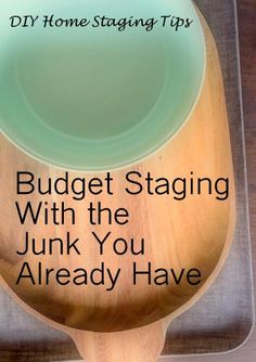 a wooden spoon with the words budget staging with the junk you already have on it