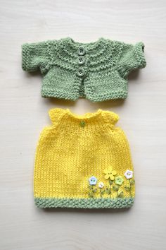 two knitted sweaters with flowers on them