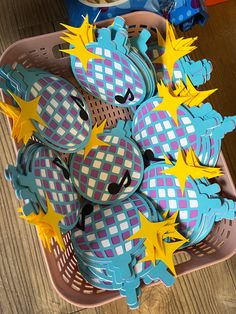 a basket filled with lots of blue and yellow decorations