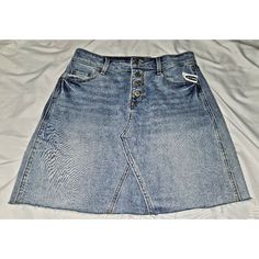 Get Ready To Turn Heads With This Stylish And Versatile Denim Skirt From Old Navy. The Skirt Features A Button Fly And A Frayed Hem For A Trendy Look. It Is Made Of A Comfortable Cotton Blend Denim Fabric, Perfect For All Seasons. Ideal For Travel, Parties, Cocktail Events, Or Casual Outings, This A-Line Skirt Is A Must-Have For Any Fashion-Conscious Woman. It Is Brand New With Tags And Has Never Been Worn Before. The Skirt Is Machine Washable For Easy Care And Maintenance. Don't Miss Out On Thi Mid-rise Blue Denim Skirt With Button Zip Fly, Casual Mid-rise Buttoned Denim Skirt, High-rise Blue Denim Skirt With Button Closure, High Rise Blue Denim Skirt With Button Closure, Casual Blue Skirt With Button Zip Fly, Casual Medium Wash Buttoned Denim Skirt, Casual Mid-rise Denim Skirt With Button Closure, Casual High Rise Skirt With Snap Buttons, Casual High-rise Skirt With Snap Buttons