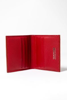 The Tremont Wallet is a masterful combination of luxury and sophistication, crafted with from red American alligator and a red French goatskin interior. Fully lined bill pockets and 6 center facing slot card pockets with black pocket lining provide the perfect amount of space for your essentials. Stylish and timeless, this bi-fold wallet is a must-have for a modern man's fashion portfolio. If you are looking for a statement piece to accessorize your fashion fit, this is the bi-fold wallet for yo Red Bifold Wallet For Formal Occasions, Red Leather Trifold Wallet For Formal Occasions, Red Trifold Wallet With Rfid Blocking For Formal Use, Red Bifold Wallet For Formal Use, Luxury Trifold Card Holder With Coin Pocket, Red Formal Card Holder With Rfid Blocking, Luxury Trifold Wallet With Card Slots, Luxury Trifold Wallet With Smooth Grain, Elegant Red Bifold Card Holder