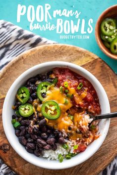 a bowl filled with black beans, rice and green peppers