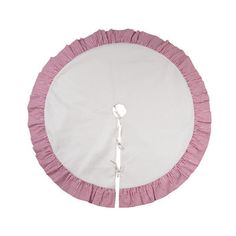 a pink and white round bed with ruffles on the bottom, in front of a white background