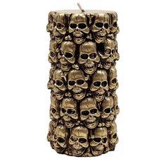 a candle that has many skulls on it