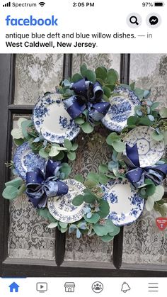 a wreath with blue and white plates on it