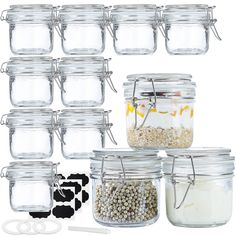 there are many glass jars with lids and spoons