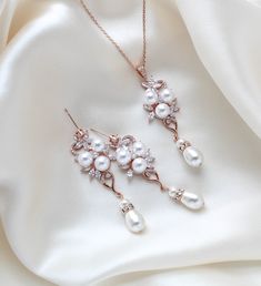 This rose gold bridal necklace and earrings set brings together the best of the best: rose gold, a metal that is highly appreciated these days for its romantic feeling; crystals, an element that adds shine and glamour to your entire look; and pearls, which add that perfect touch of timeless elegance. Such a stunning bridal jewelry set! Earrings dangle 2-3/8 inch and are 3/4 inch at their widest. Necklace measures 16 inches and extends to 18 inches. PLEASE ALLOW APPROX 7 BUSINESS DAYS FOR COMPLETION BEFORE SHIPPING.Gorgeous sparkle !This is an original design by © Treasures by Agnes FOR MATCHING PIECES SIMPLY TYPE "MIA" IN THE SEARCH BAR Best Rose, Gold Bridal Necklace, Pearl Drop Necklace, Rose Gold Bridal, Set Earrings, Search Bar, Necklace And Earrings Set, Necklace And Earring Set, Crystal Drop Earrings