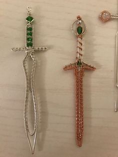 three different types of cross brooches on a table