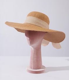 Tan toyo braided sun hat with beige bow. Complete with adjustable ties inside the crown that ensures a perfect fit.Available while supplies last. Adjustable Straw Boater Hat For Sunbathing, Adjustable Straw Panama Hat For Sunbathing, Adjustable Natural Panama Hat For Sunbathing, Adjustable Woven Boater Hat For Kentucky Derby, Adjustable Beige Straw Boater Hat, Adjustable Paper Straw Hat For Sunbathing, Adjustable Straw Hat With Uv Protection For Kentucky Derby, Cream Adjustable Summer Boater Hat, Cream Summer Boater Hat