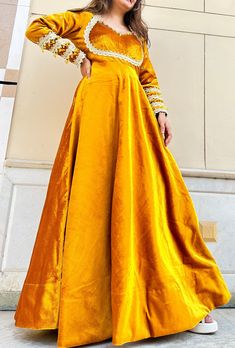 Hand made  Delivery from a small business in India  Feel traditional throughout your event wearing our mustard yellow velvet gown  Gown made in different types of laces and little bit of hand work  This gown can become a great part of wedding and wedding events Product details  Colour:- mustard yellow  Fabric:- velvet  Floor length  Type:- gown  Package contains:-1 hand work gown Model wearing:- S size Model height:- 5'4/ 162.56cm Size chart  XS (US Size) Shoulder:- 13-14 Bust:- 31-33 Waist:- 26-27 Hip:- 36-37 S (US Size) Shoulder:- 14-15 Bust:- 34-35 Waist:- 28-29 Hip:- 38-39 M (US Size) Shoulder:- 15-16 Bust:- 36-37 Waist:- 29-30 Hip:- 39-40 L (US Size) Shoulder:- 15-16 Bust:- 38-40 Waist:- 31-32 Hip:- 40-42 XL(US Size) Shoulder:- 16-17 Bust:- 40-42 Waist:- 33-34 Hip:- 42-44 XXL (US Size Velvet Yellow Dress, Traditional Long Sleeve Yellow Gown, Gold Anarkali Gown With Long Sleeves, Yellow Long-sleeved Dress With Dabka Work, Yellow Long-sleeved Dabka Work Dress, Yellow Party Gown With Dabka Work, Yellow Long Sleeve Party Gown, Gold Velvet Dress For Festive Occasions, Gold Velvet Lehenga For Wedding