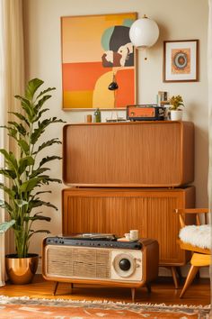 a living room with an old fashioned radio and plant