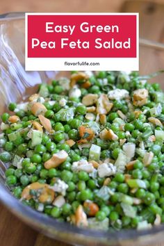 a bowl filled with peas and nuts next to a red sign that says easy green pea salad